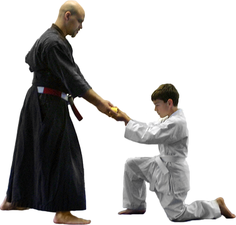 karate student receiving belt promotion